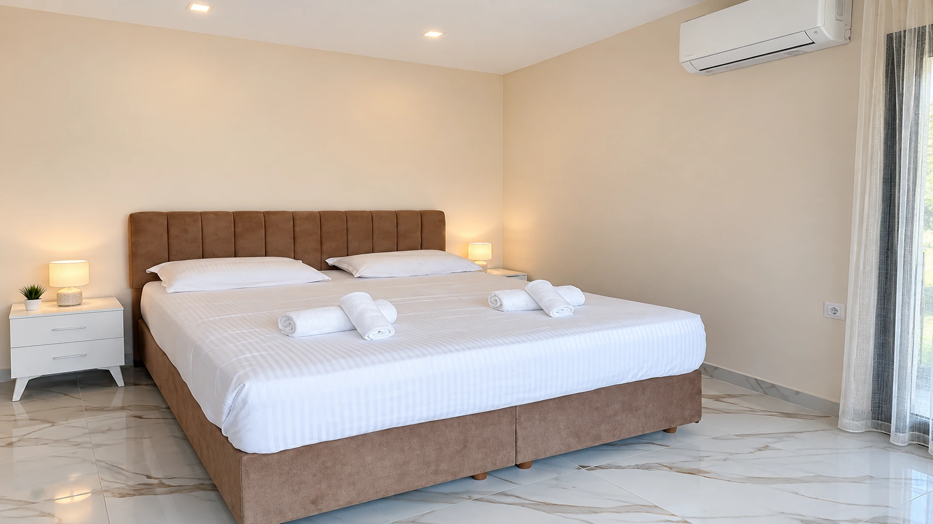 Real photo of a bright bedroom at Alex Studios