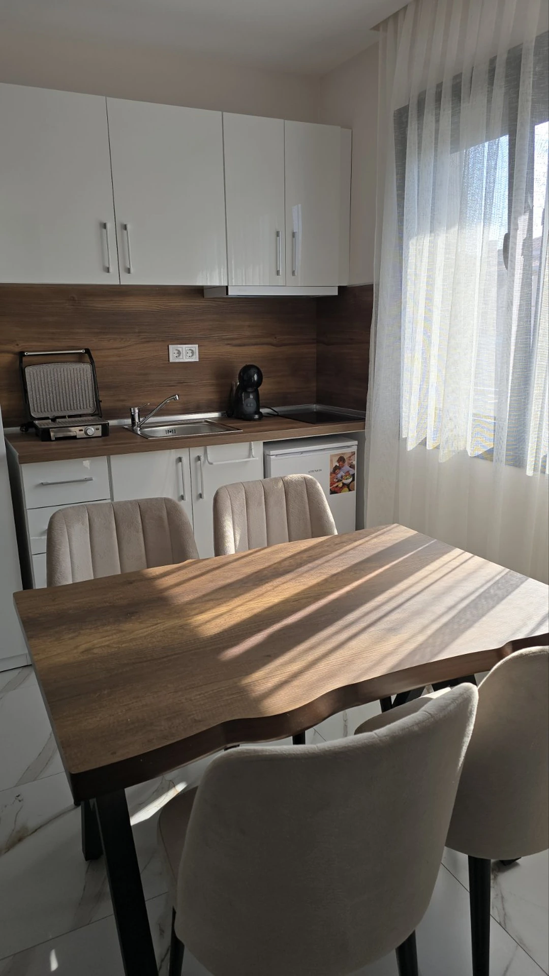 Real kitchenette and dining space at Alex Studios
